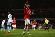 Lukas Podolski celebrated after scoring Arsenal's third against West Ham at the Emirates.